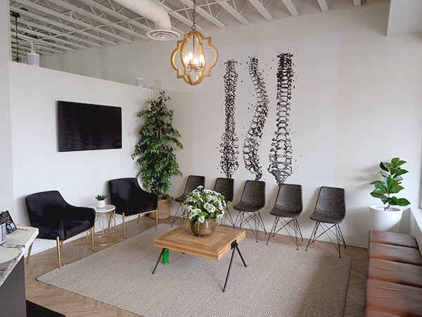 Dr. Michael Kricken with a patient at Lakeview Chiropractic in Calgary