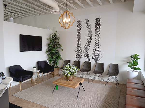 Dr. Michael Kricken with a patient at Lakeview Chiropractic in Calgary